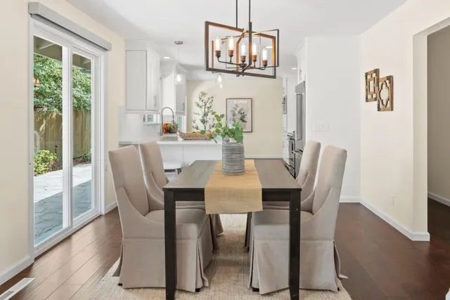 a view of a dining room with furniture window and wooden floor