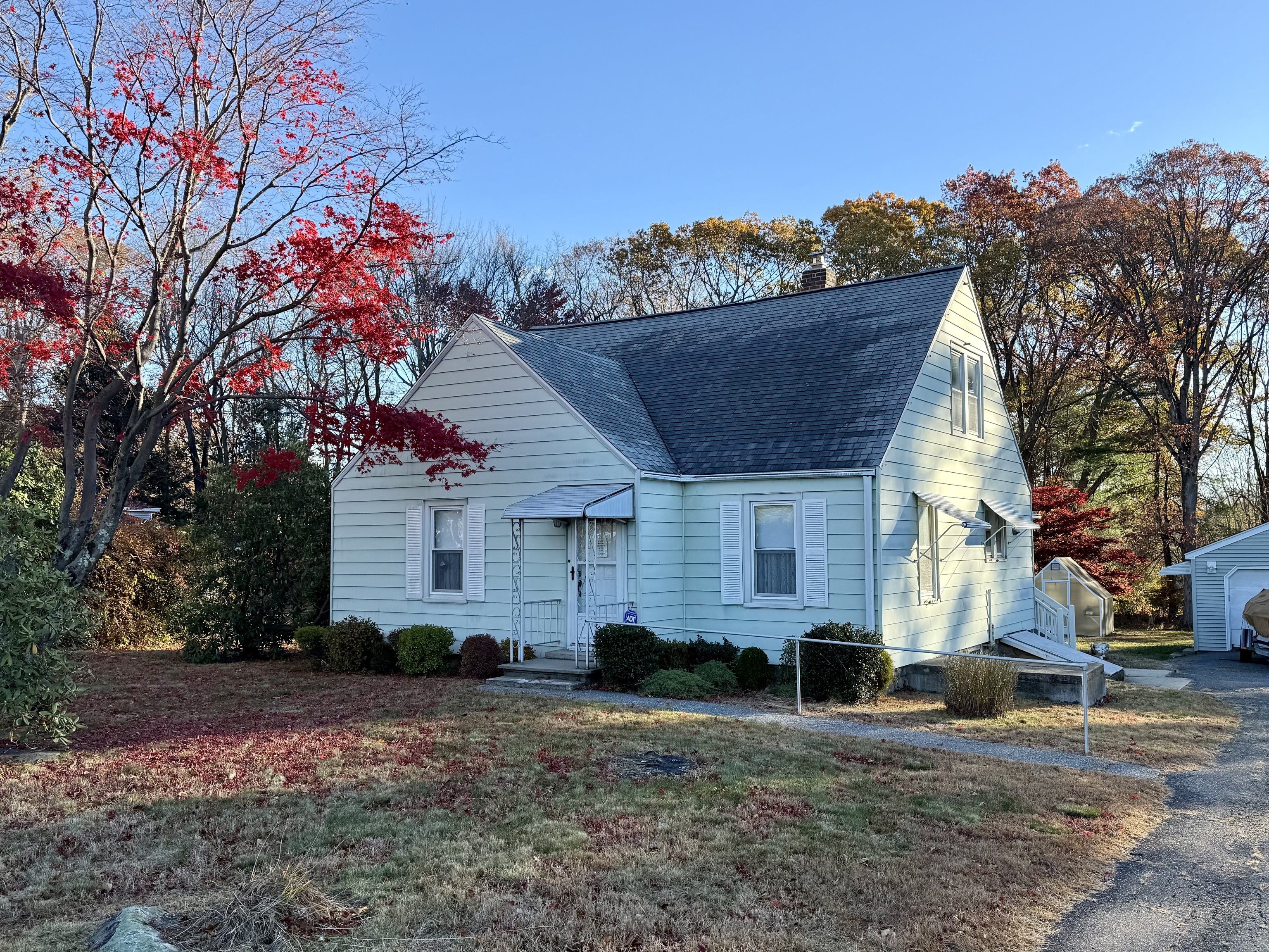 a front view of a house with a yard