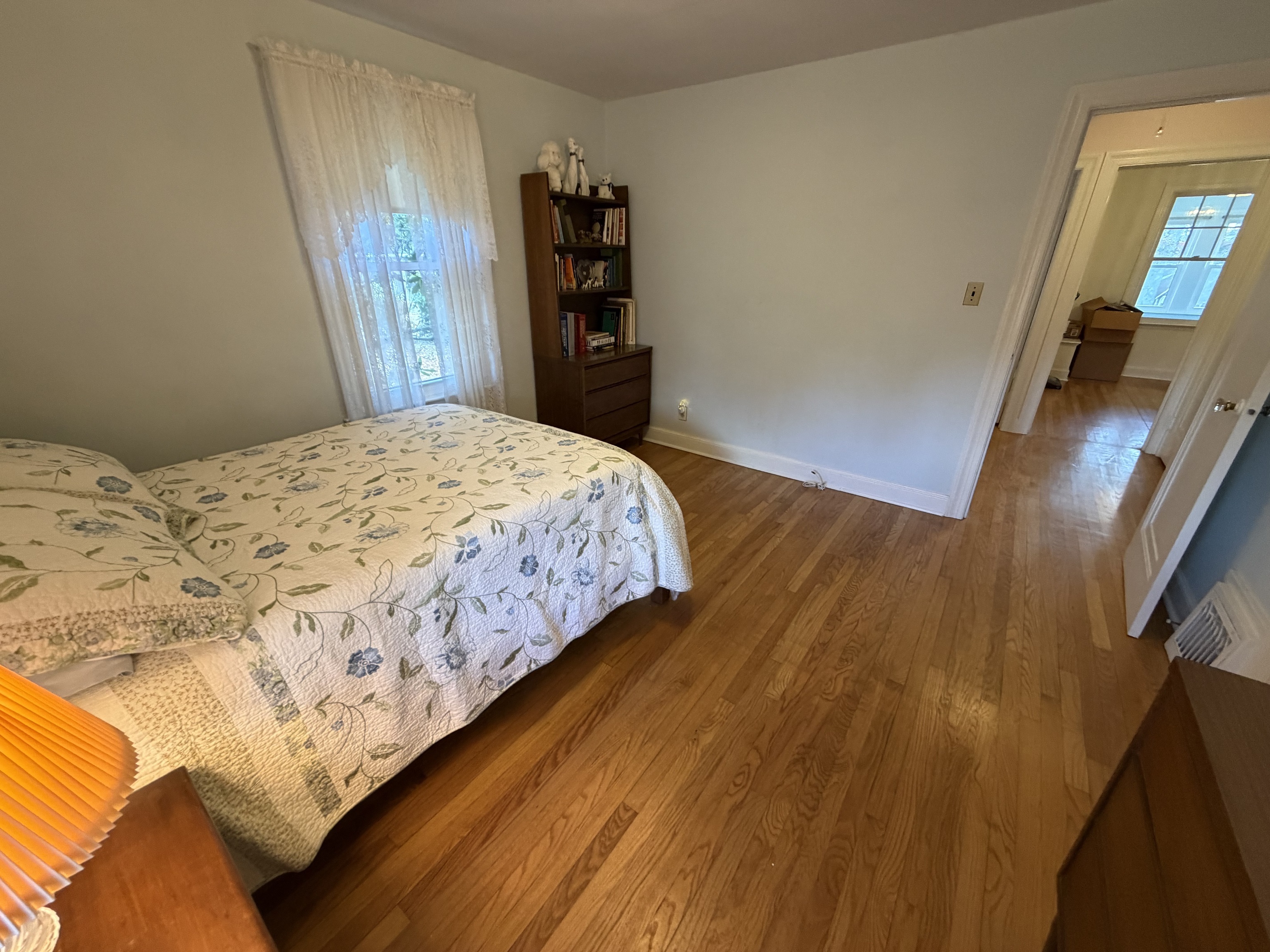 65 Clark Hill Road Prospect, CT 06712 - Photo 12 of 30 a bedroom with a bed and wooden floor