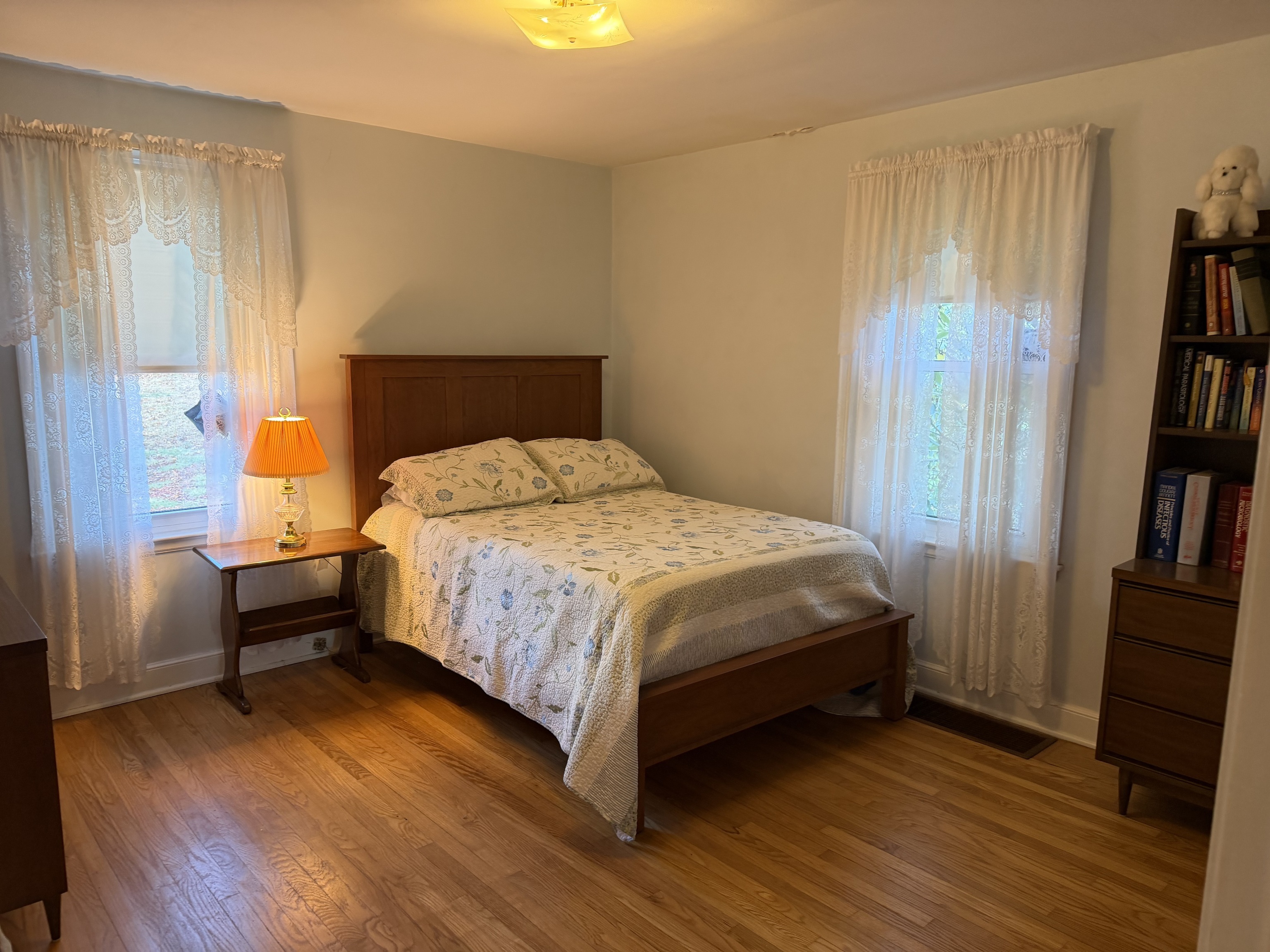 65 Clark Hill Road Prospect, CT 06712 - Photo 13 of 30 a bedroom with a bed and a book shelf