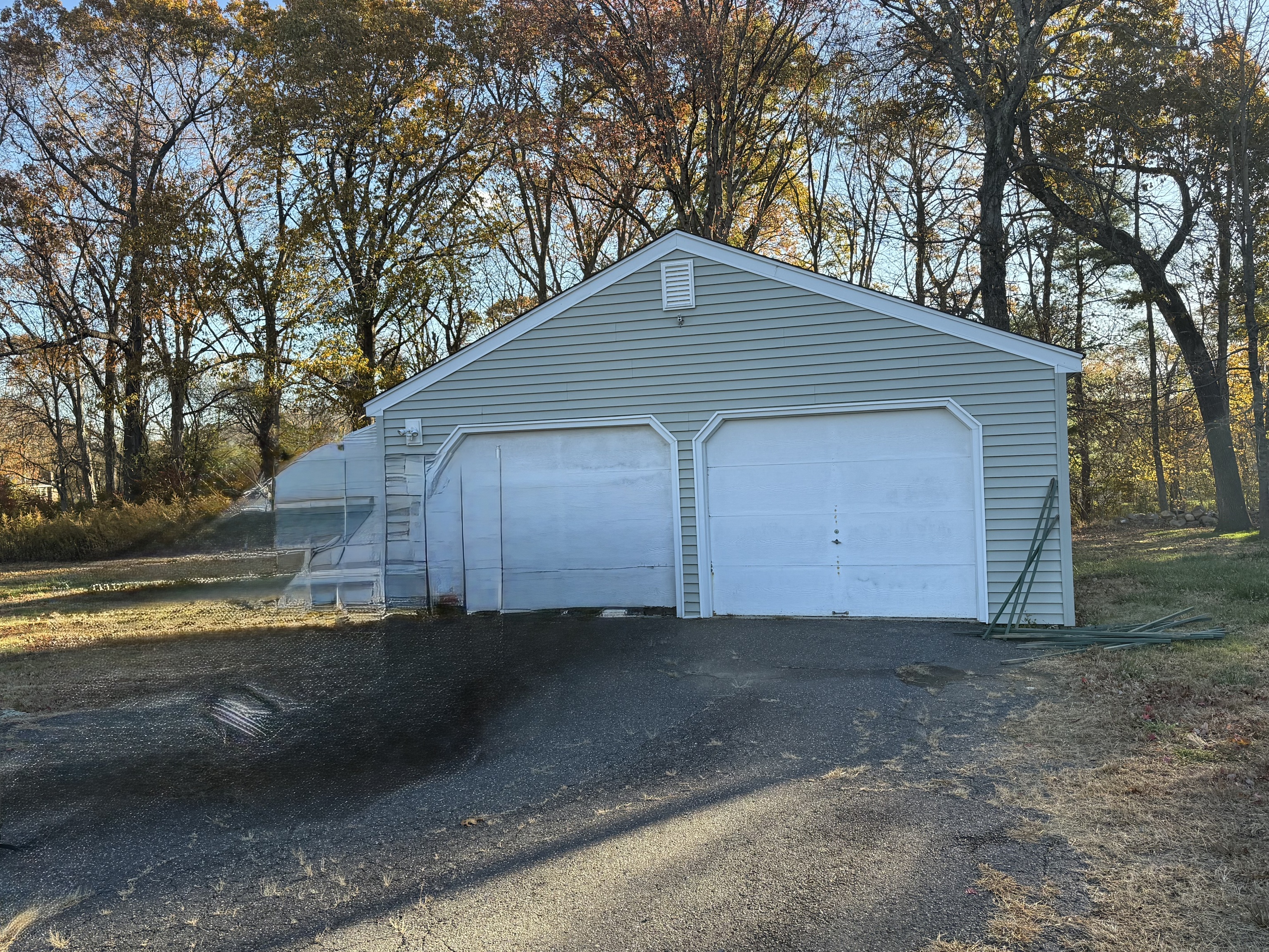 65 Clark Hill Road Prospect, CT 06712 - Photo 26 of 30 a front view of a house with a yard and garage