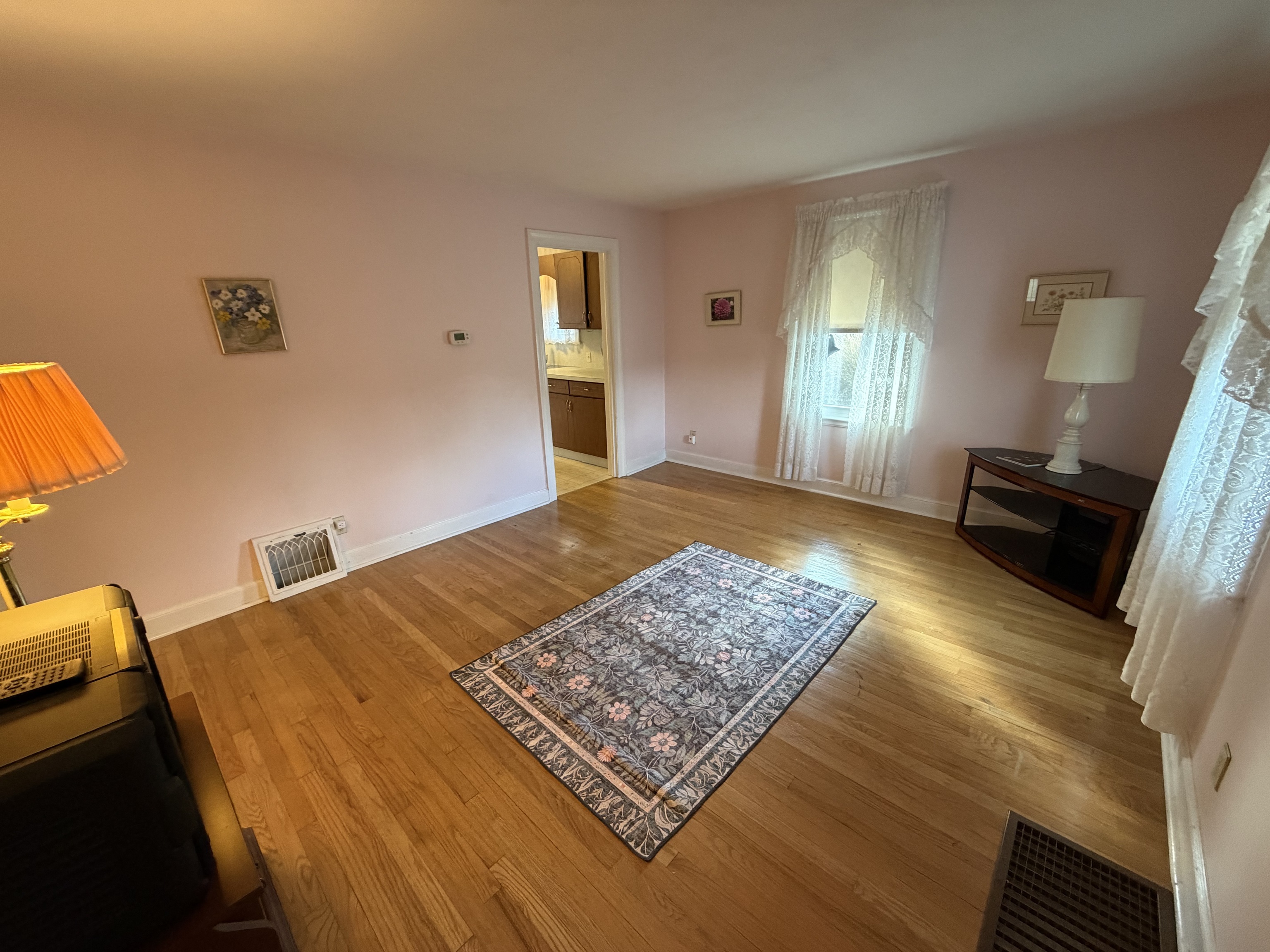 65 Clark Hill Road Prospect, CT 06712 - Photo 4 of 30 a bedroom with a bed rug and wooden floor