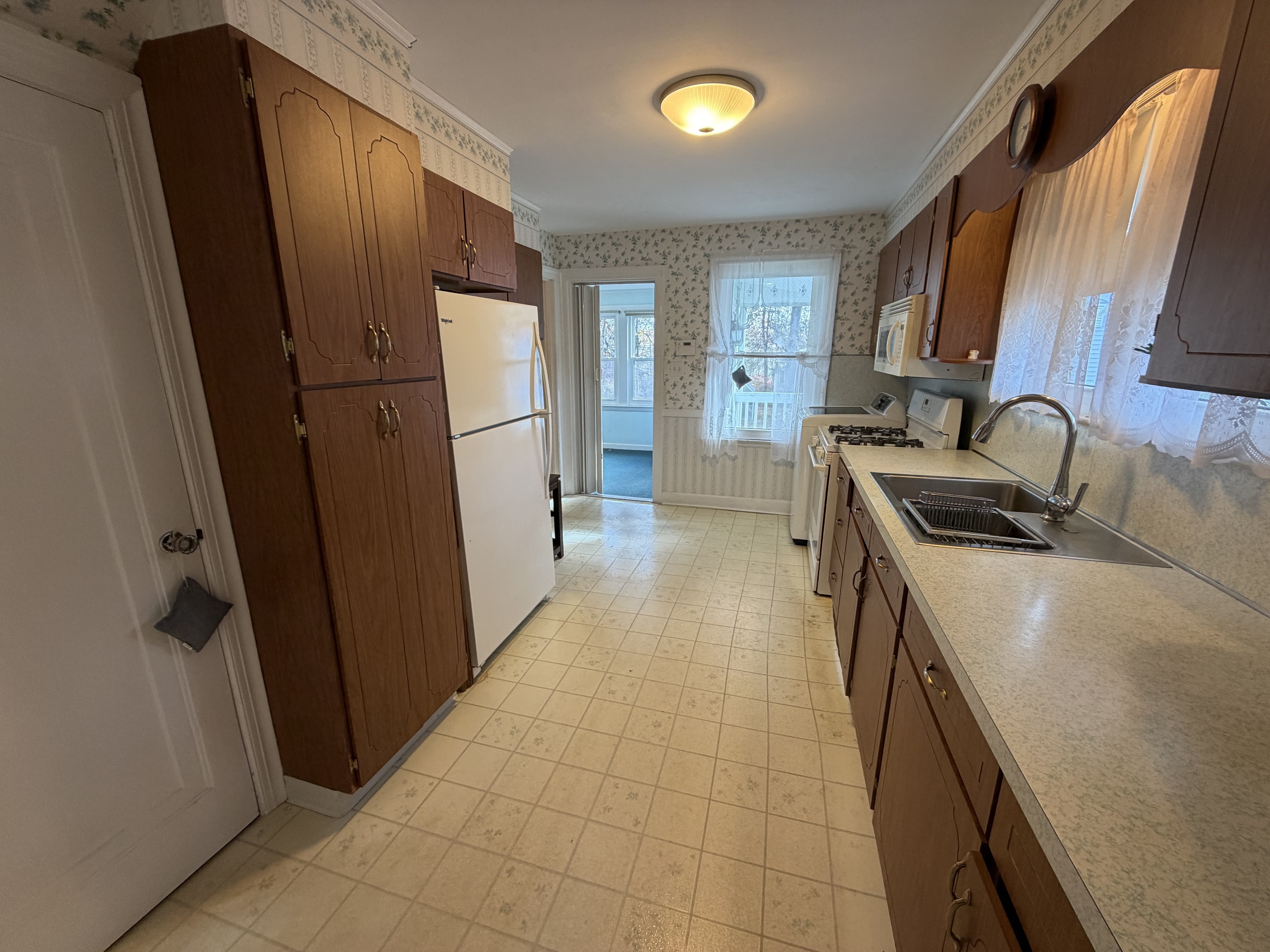 65 Clark Hill Road Prospect, CT 06712 - Photo 7 of 30 a kitchen with sink a refrigerator and a stove