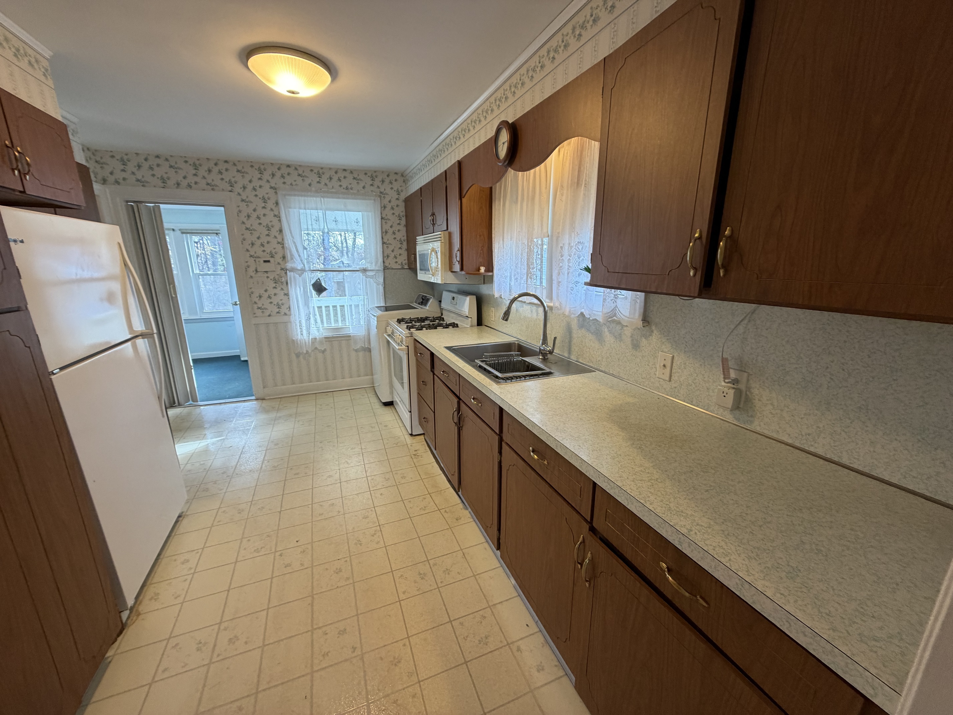 65 Clark Hill Road Prospect, CT 06712 - Photo 8 of 30 a kitchen with a sink and a stove top oven