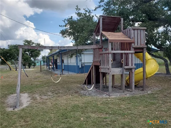 a view of swimming pool with seating space and hardwood floor