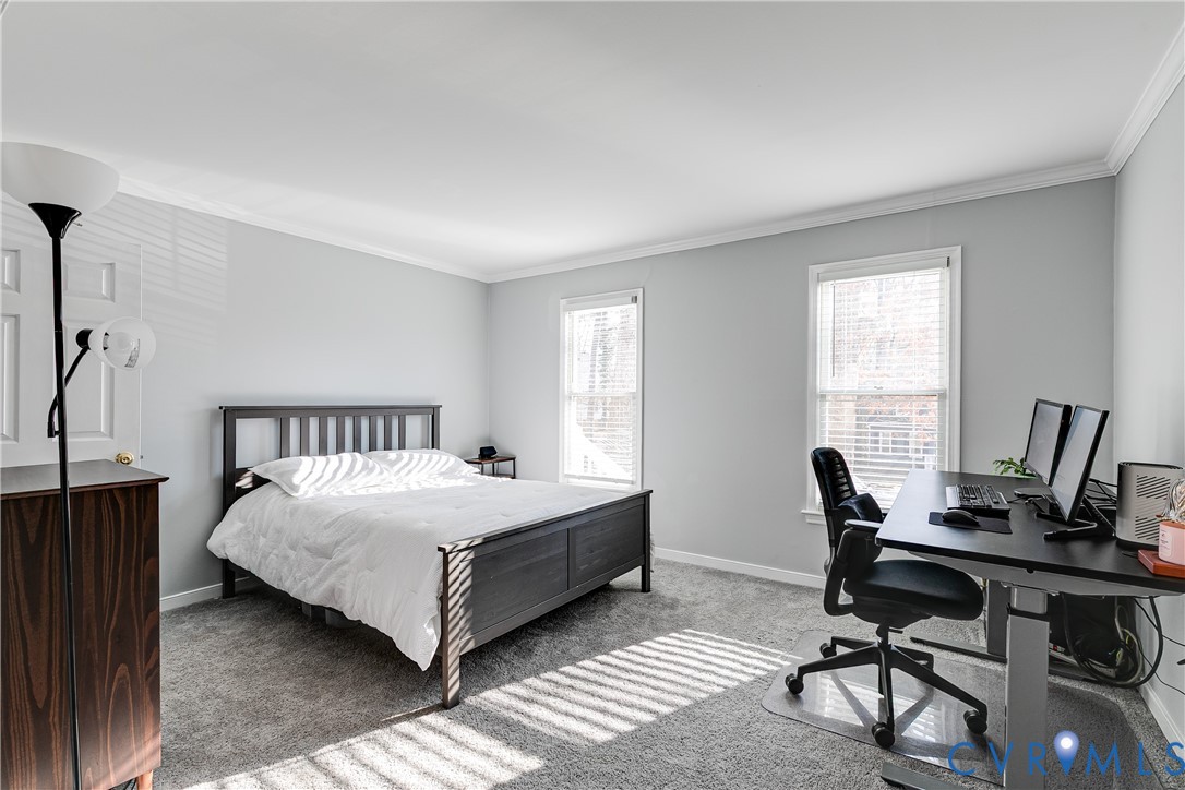 14710 Mill Spring Drive Midlothian, VA 23112 - Photo 11 of 24 a bedroom with a bed a table and a two windows