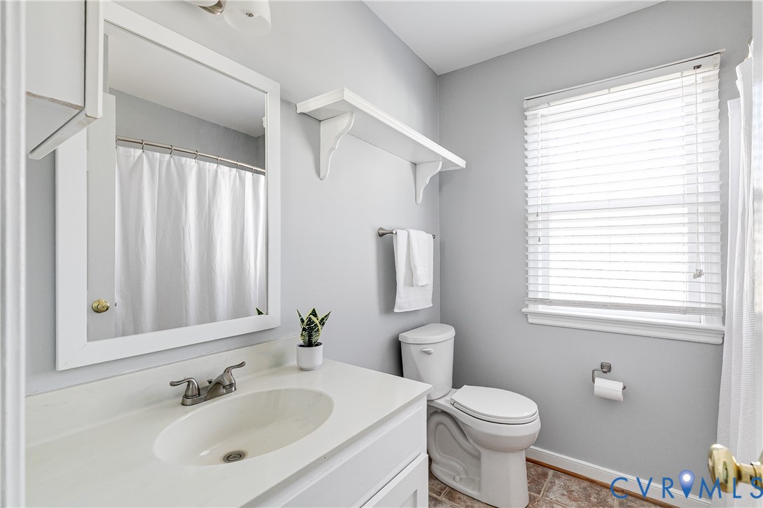 14710 Mill Spring Drive Midlothian, VA 23112 - Photo 18 of 24 a bathroom with a sink toilet and shower