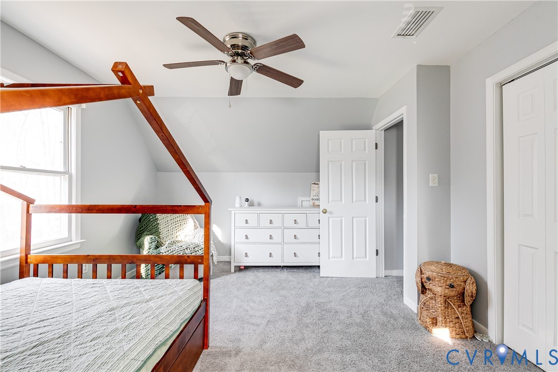 14710 Mill Spring Drive Midlothian, VA 23112 - Photo 20 of 24 a view of a bedroom with furniture and windows