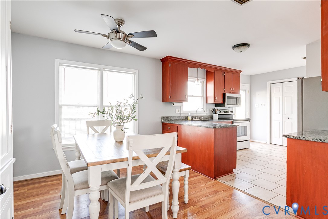 14710 Mill Spring Drive Midlothian, VA 23112 - Photo 6 of 24 a view of a dining room with furniture window and wooden floor