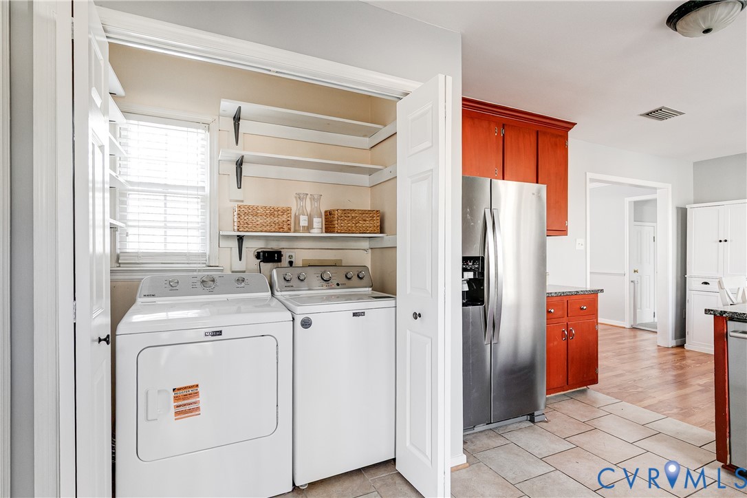 14710 Mill Spring Drive Midlothian, VA 23112 - Photo 10 of 24 a kitchen with stainless steel appliances a refrigerator sink and cabinets
