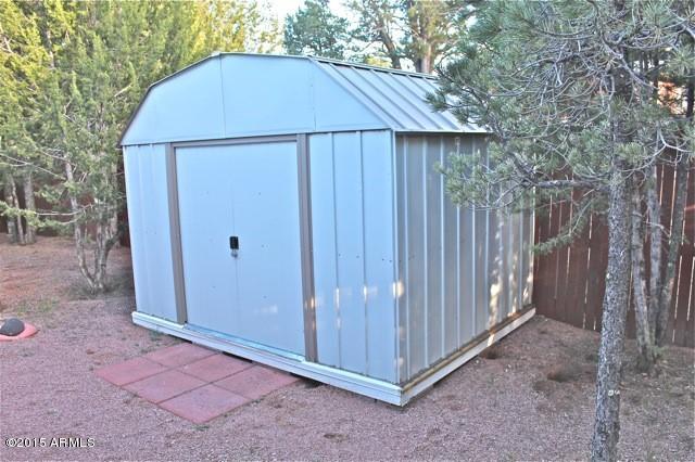 2119 Blue Jay Road Overgaard, AZ 85933 - Photo 18 of 28 a view of a small house backyard