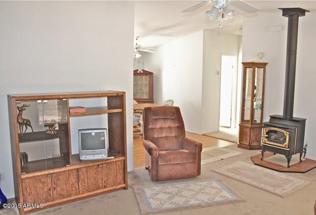 2119 Blue Jay Road Overgaard, AZ 85933 - Photo 2 of 28 a living room with furniture and a window