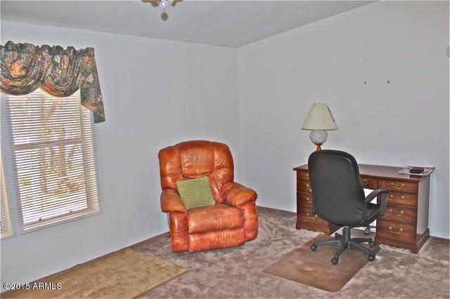 2119 Blue Jay Road Overgaard, AZ 85933 - Photo 3 of 28 a view of a workspace with furniture and a window