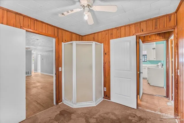 a view of a kitchen with a sink and a window