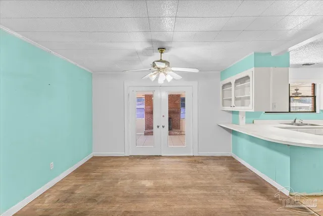 a kitchen with refrigerator and window
