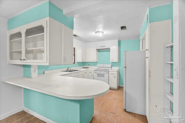 a view of an empty room with window and fire place