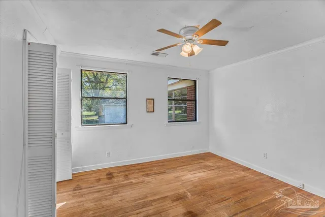 a bathroom with a double vanity sink a mirror and a shower