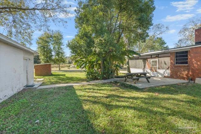 a room with a bed and a television