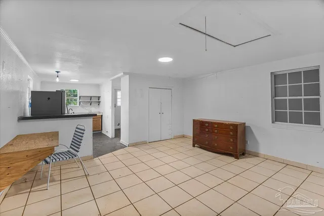 a large kitchen with stainless steel appliances granite countertop a refrigerator and a sink