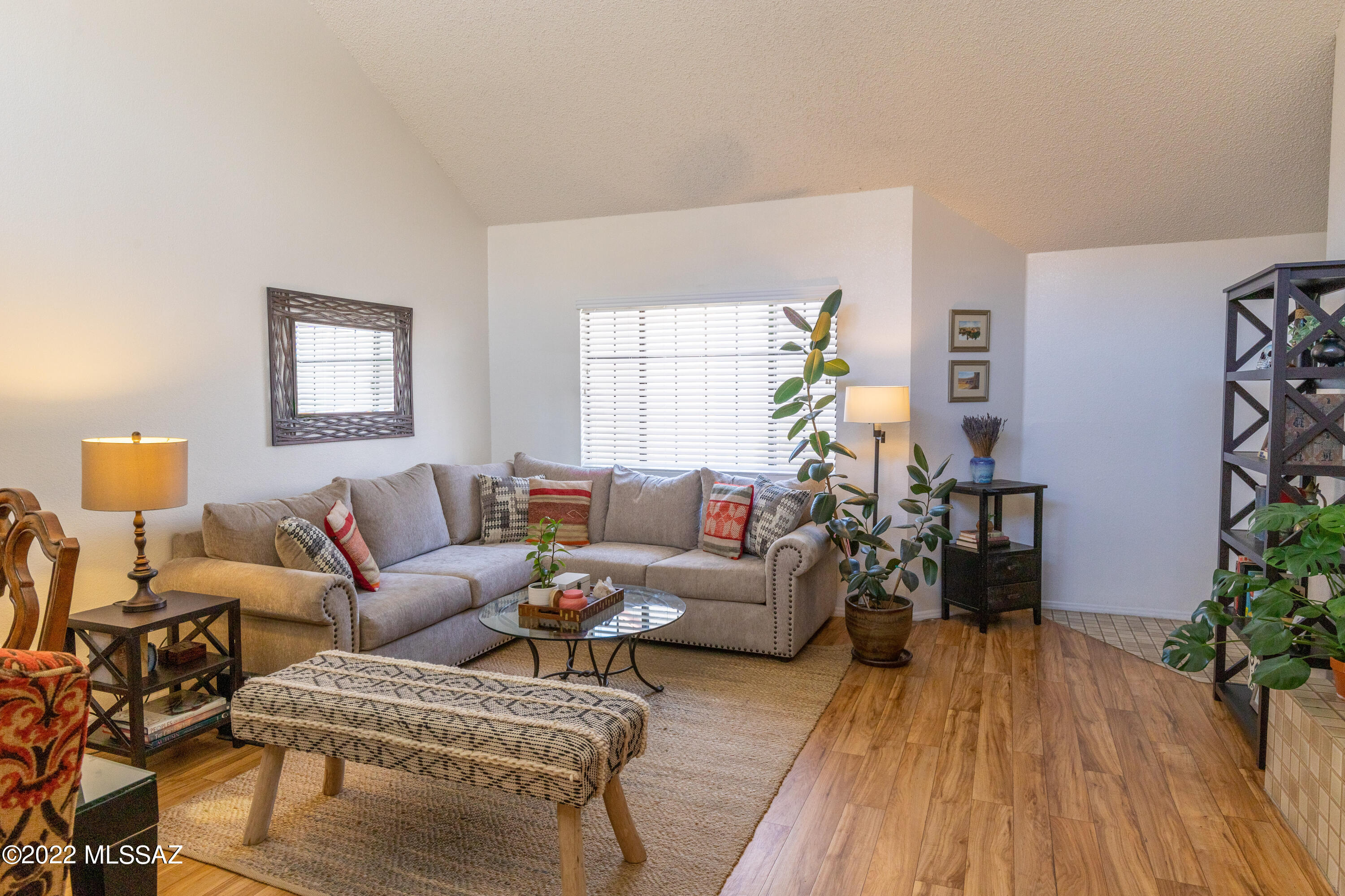 1200 East River Road, Unit F69 Tucson, AZ 85718 - Photo 3 of 22 a living room with furniture and wooden floor
