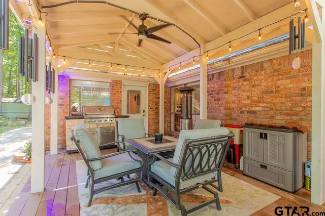 a view of two chairs in the balcony