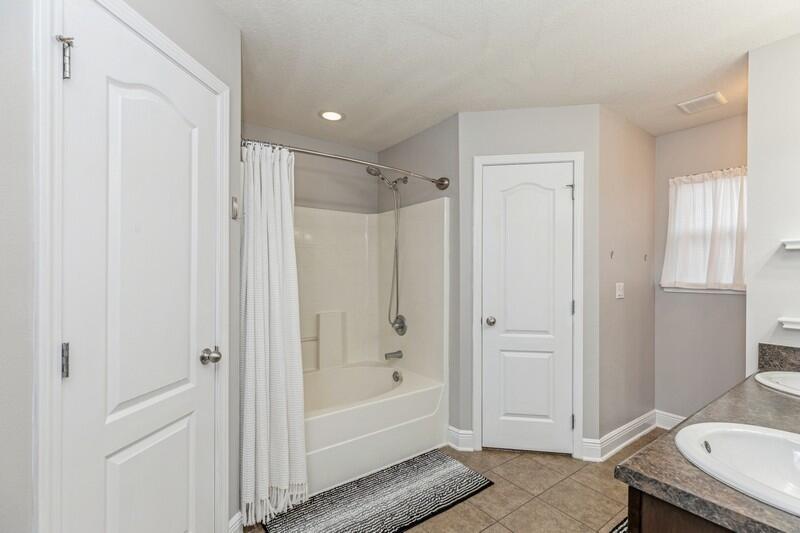 4640 Hermosa Road Crestview, FL 32539 - Photo 12 of 37 a bathroom with a granite countertop sink a toilet and shower