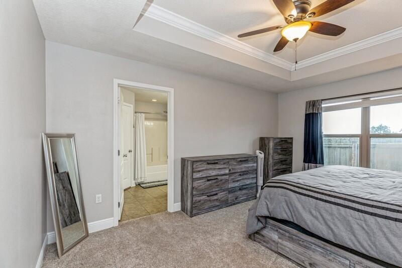4640 Hermosa Road Crestview, FL 32539 - Photo 32 of 37 a bedroom with a bed and a ceiling fan