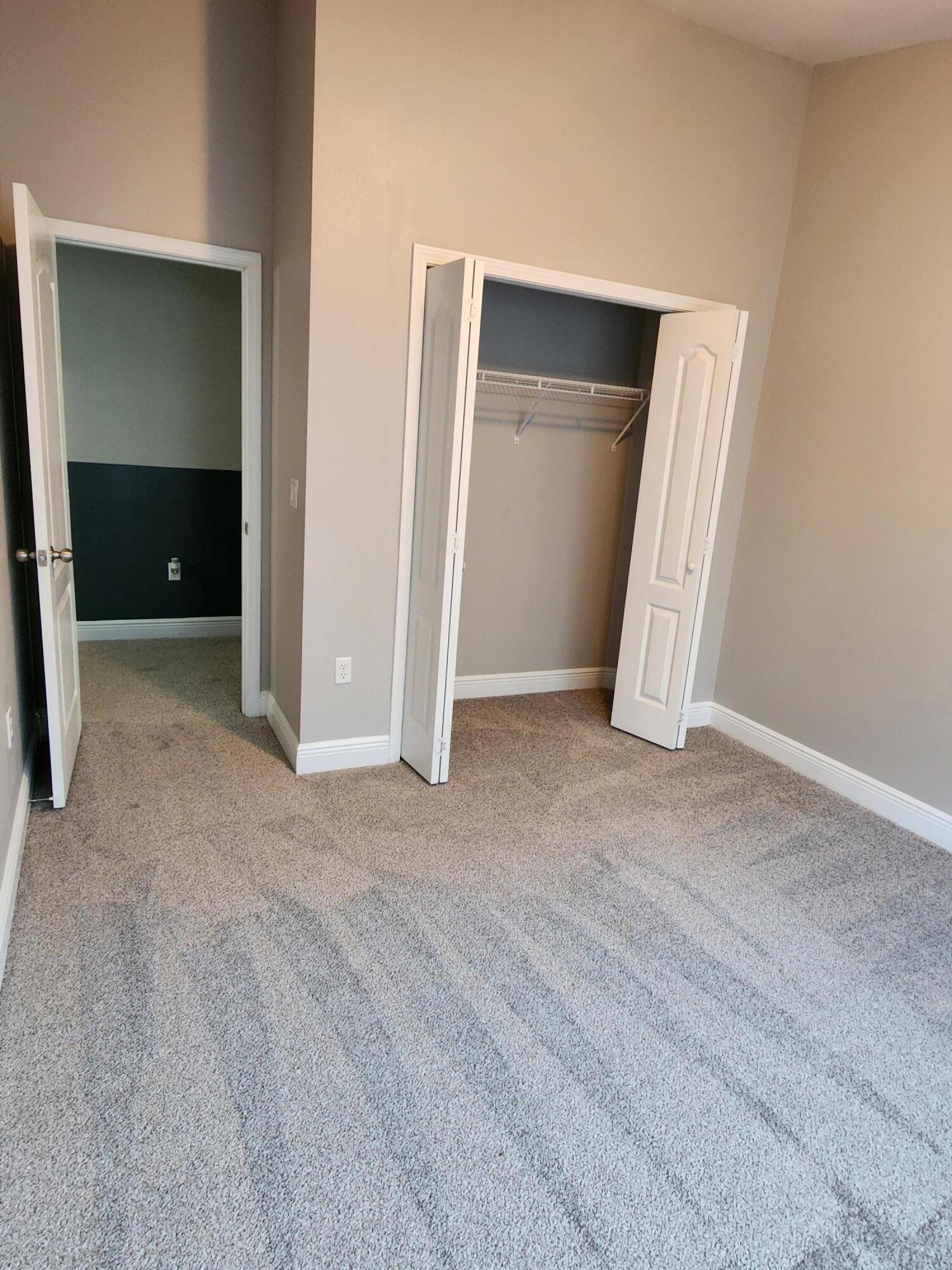 4640 Hermosa Road Crestview, FL 32539 - Photo 35 of 37 an empty room with closet and mirror
