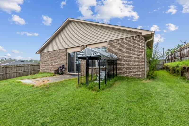 4640 Hermosa Road Crestview, FL 32539 - Photo 5 of 37 a view of a house with a backyard
