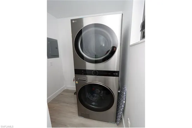 a view of backyard with potted plants and palm trees