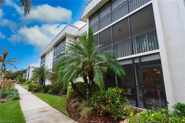 a view of swimming pool with outdoor seating