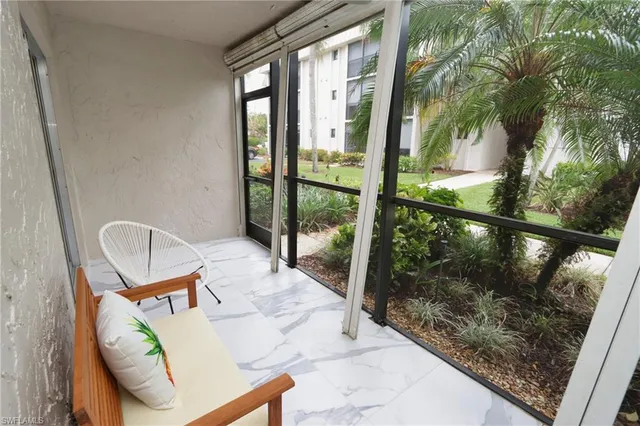 a kitchen with stainless steel appliances kitchen island granite countertop a stove and a refrigerator