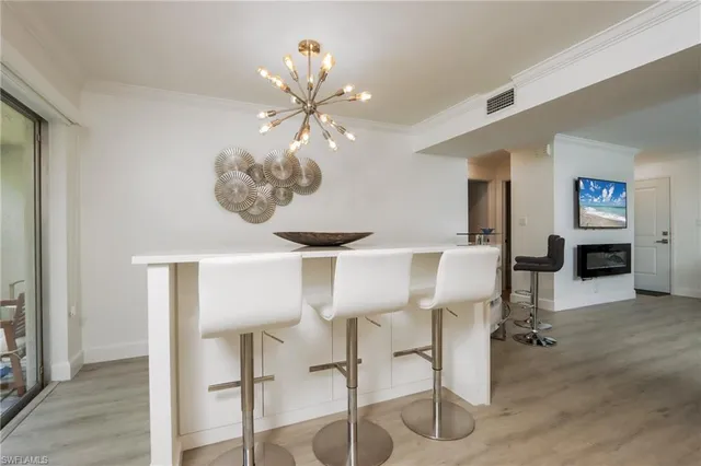 a view of a livingroom with furniture and chandelier