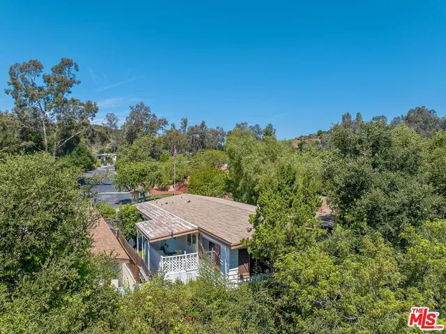 an aerial view of a house with yard and outdoor space
