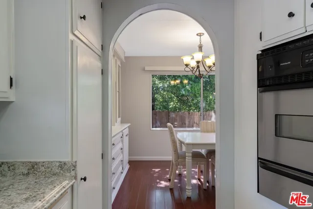 a view of a livingroom with furniture window and wooden floor