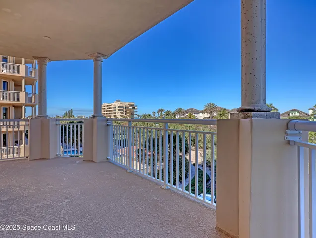 a view of a balcony with wooden floor
