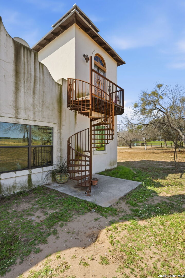 1150 Bruce Road Poteet, TX 78065 - Photo 28 of 33 a view of a house with a yard