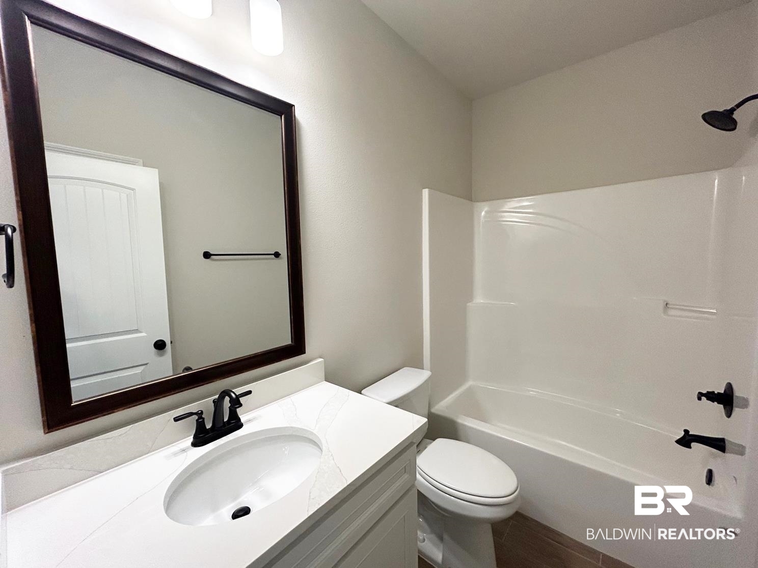 872 Sumter Loop Foley, AL 36535 - Photo 14 of 18 Full bathroom featuring vanity, toilet, and tub / shower combination
