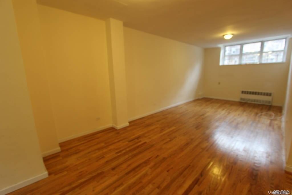 99-44 67th Road, Unit L2 Queens, NY 11375 - Photo 1 of 1 a view of empty room with wooden floor