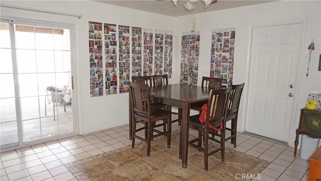 a view of a dining room with furniture and a window