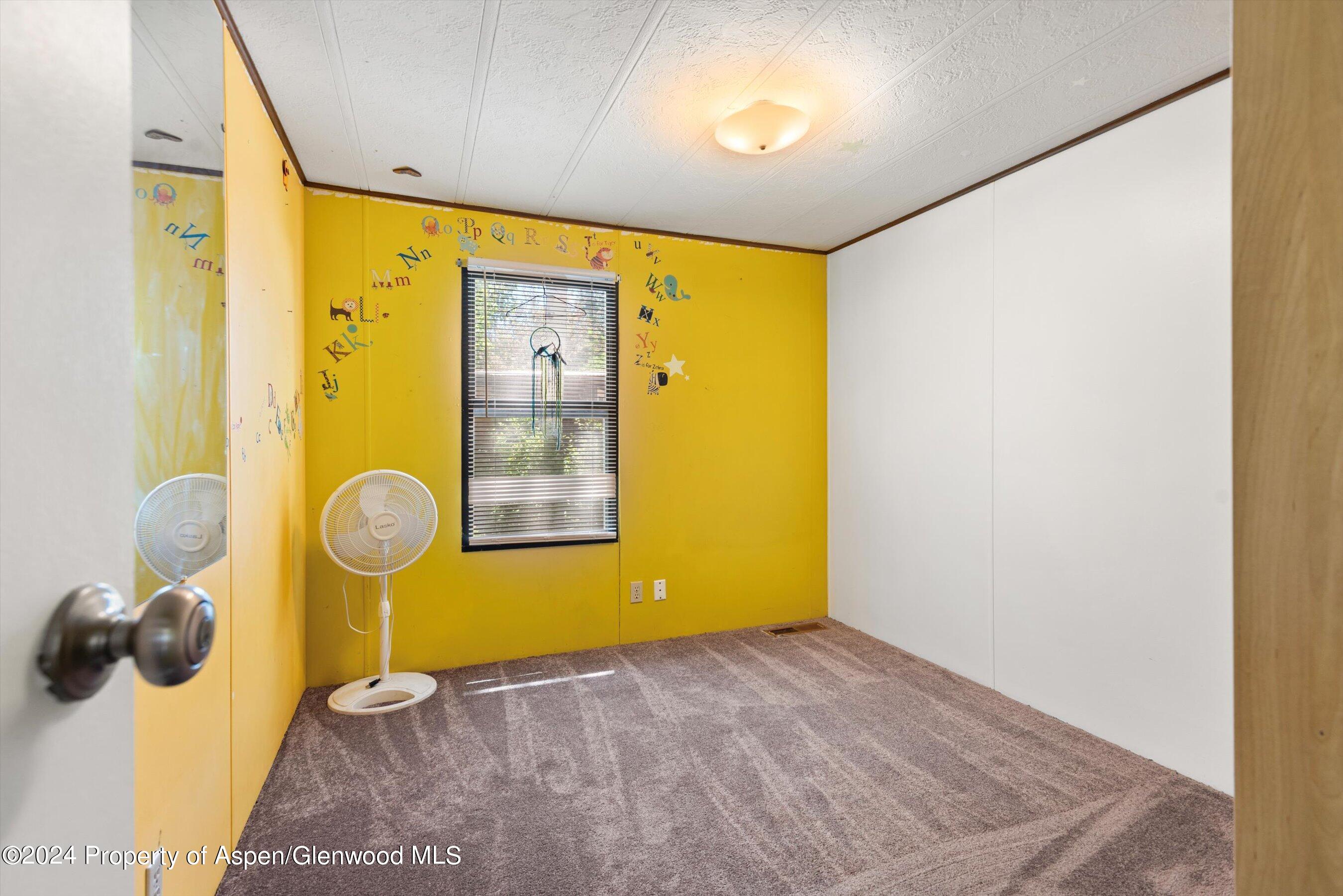 40 Aspen Village Road Aspen, CO 81611 - Photo 11 of 19 a view of a hallway with wooden floor