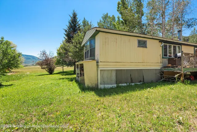 a view of a backyard with a garden