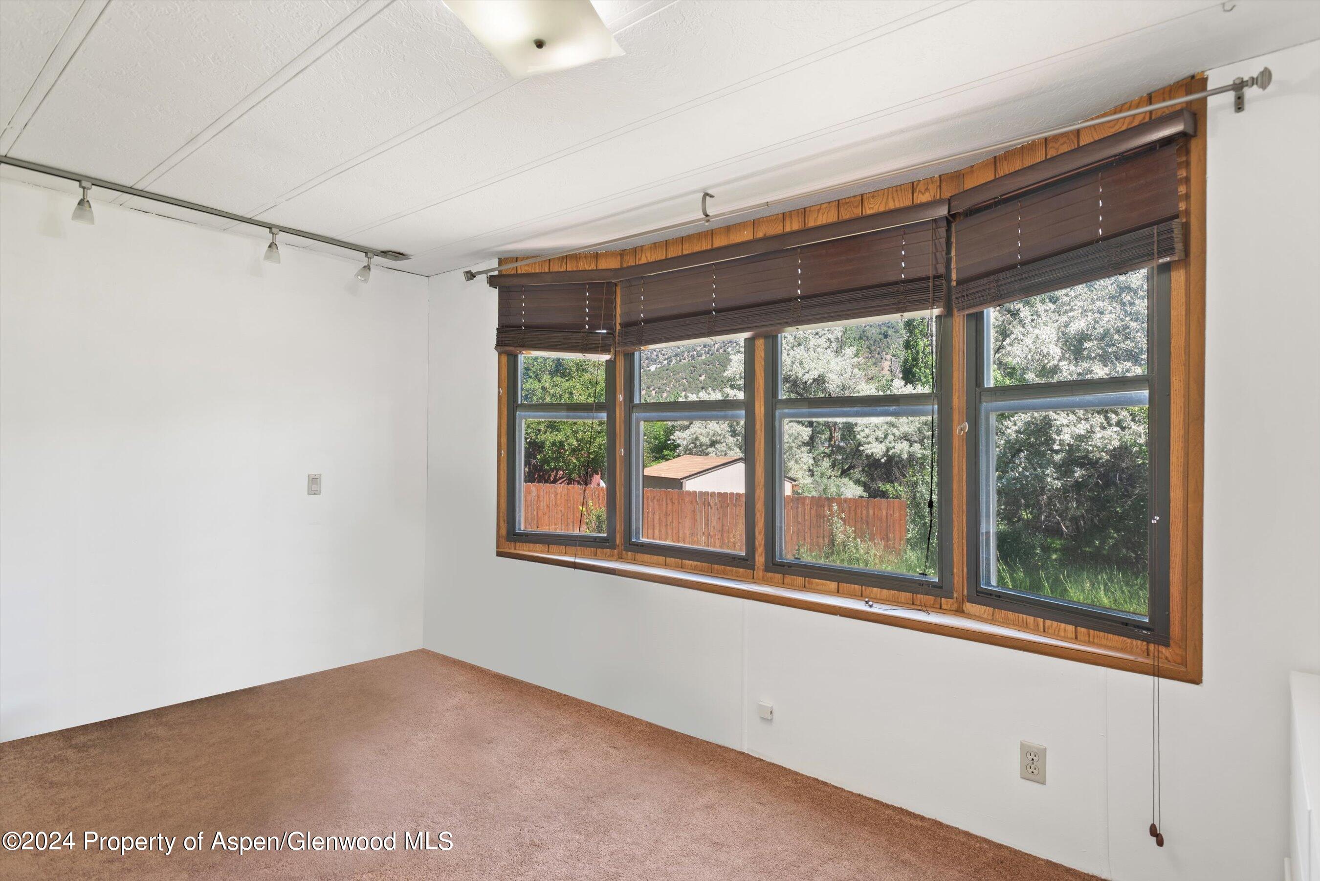 40 Aspen Village Road Aspen, CO 81611 - Photo 9 of 19 a view of an empty room with a window