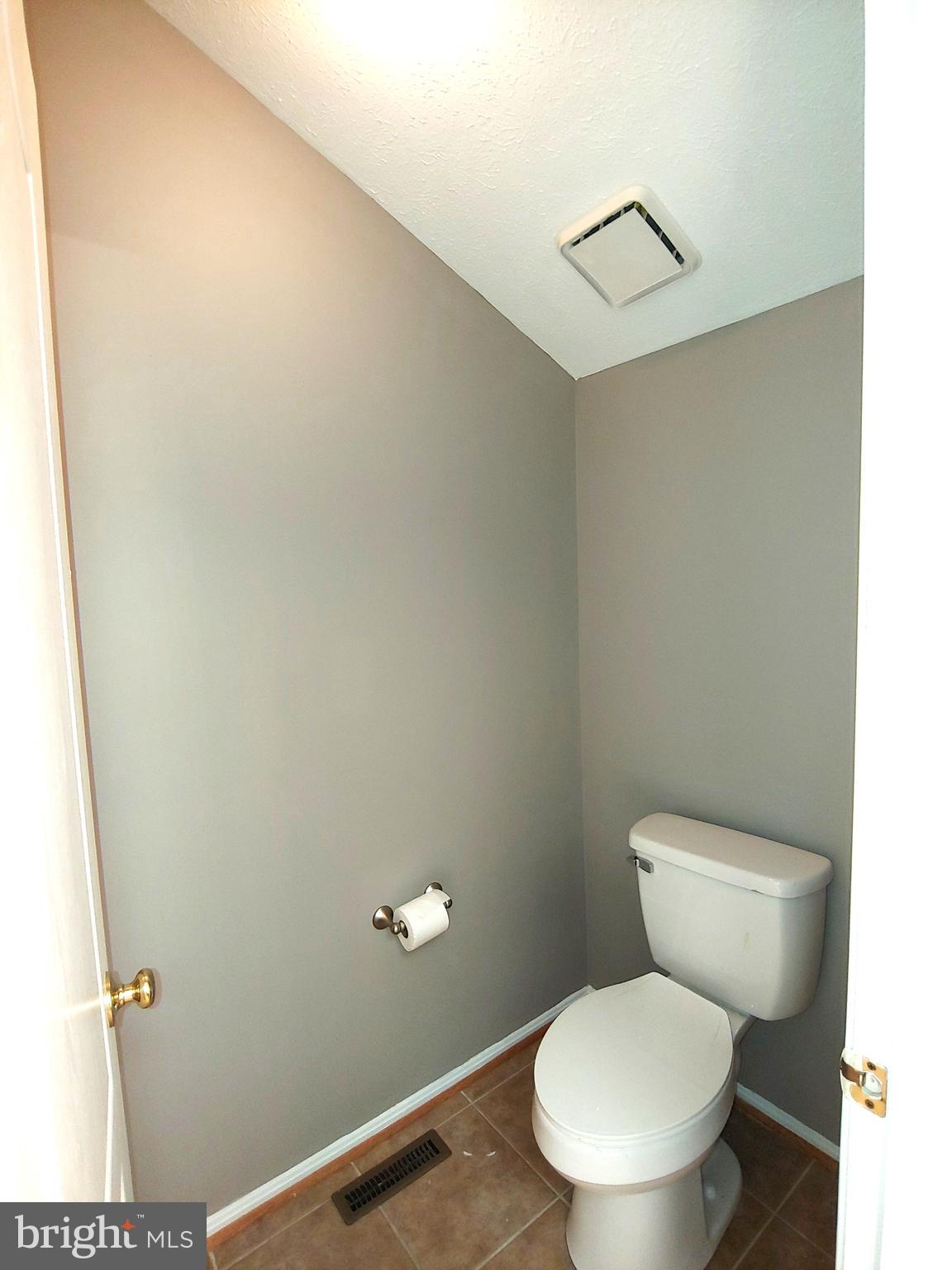 6010 Grenfell Loop Bowie, MD 20720 - Photo 31 of 32 a white toilet sitting next to a shower