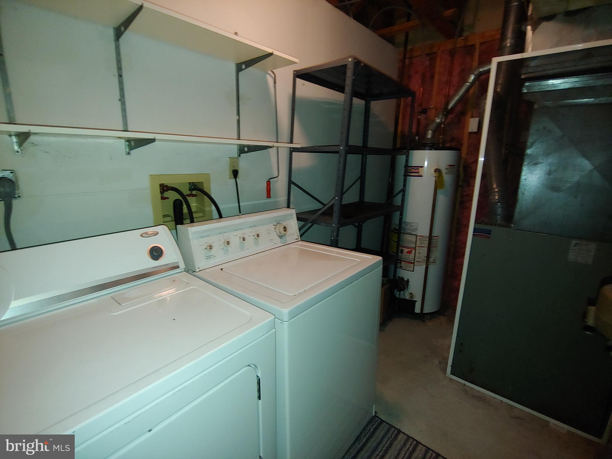 6010 Grenfell Loop Bowie, MD 20720 - Photo 5 of 32 a utility room with dryer and washer