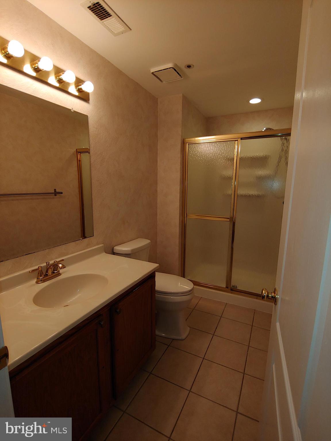 6010 Grenfell Loop Bowie, MD 20720 - Photo 8 of 32 a bathroom with a sink a toilet and shower