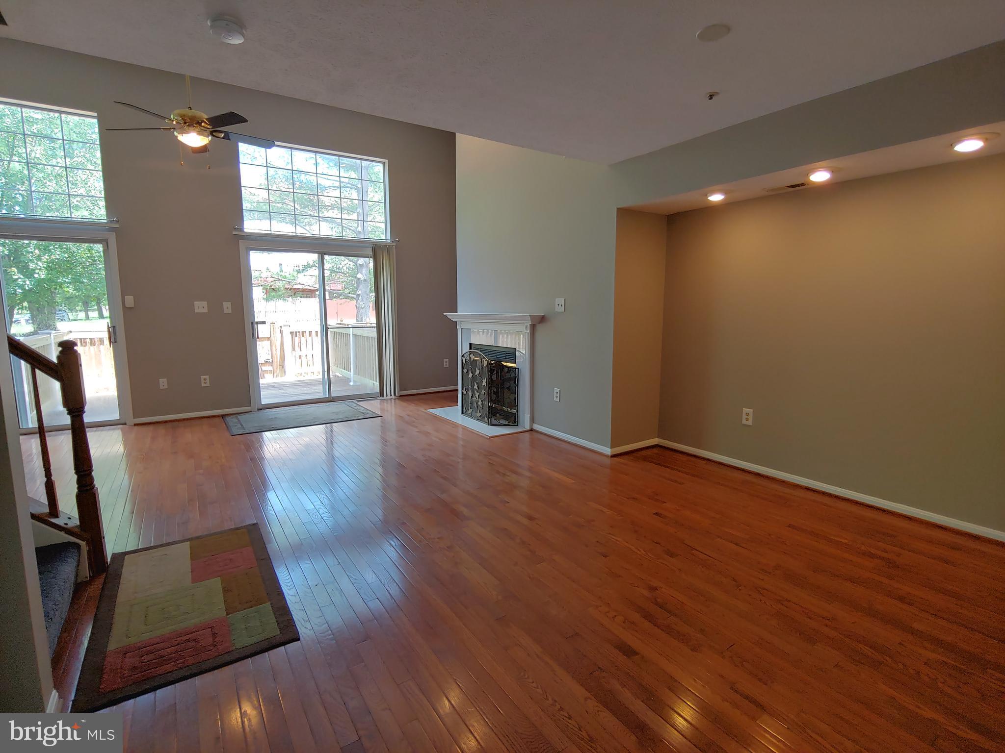 6010 Grenfell Loop Bowie, MD 20720 - Photo 9 of 32 an empty room with wooden floor and windows
