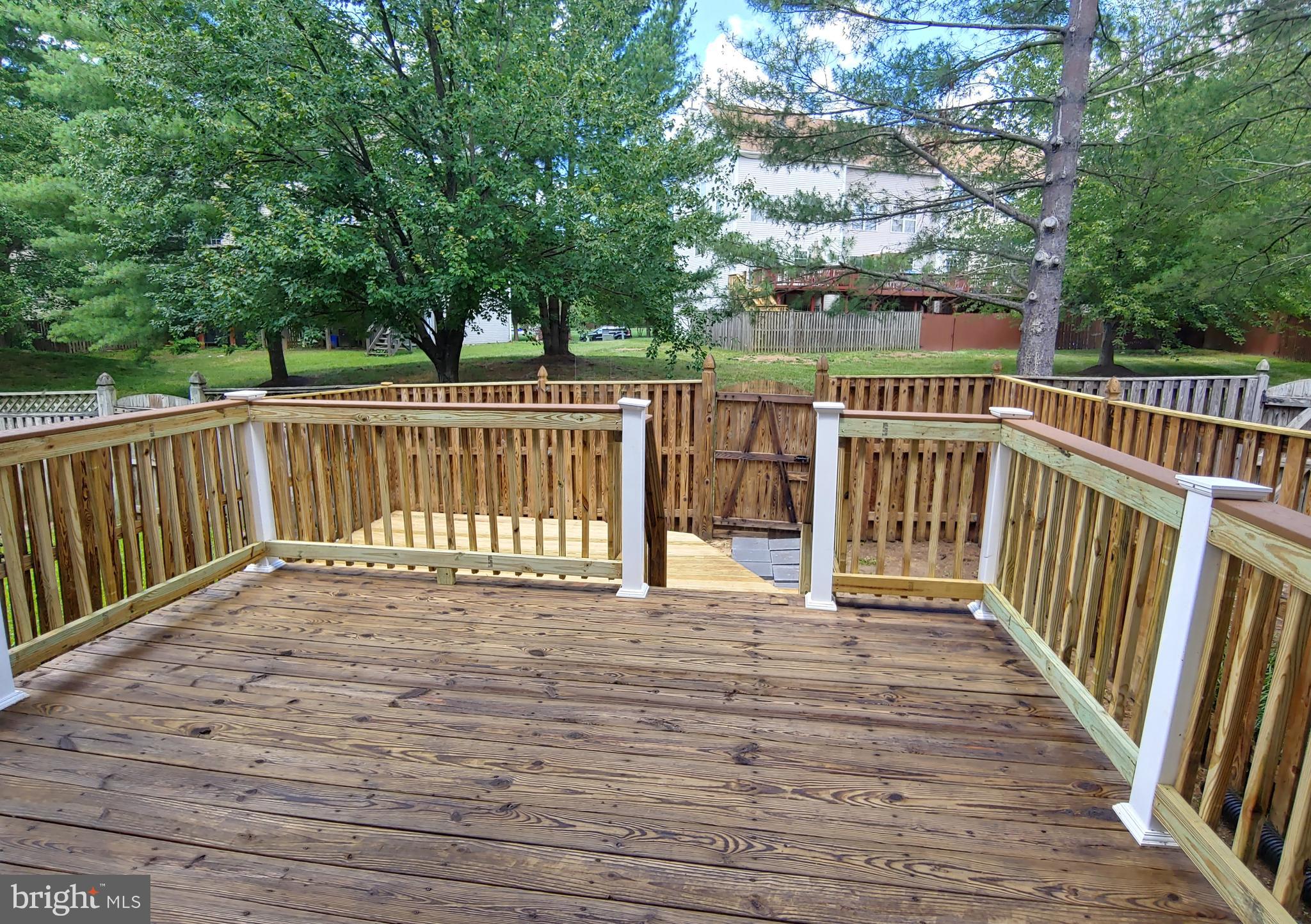 6010 Grenfell Loop Bowie, MD 20720 - Photo 10 of 32 a view of deck with wooden floor and fence