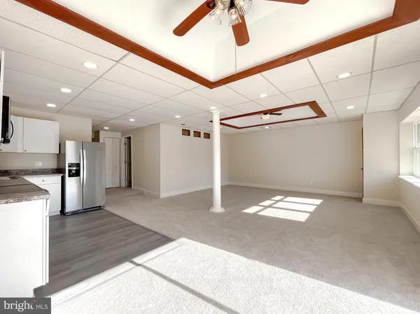 a view of gallery with wooden floor