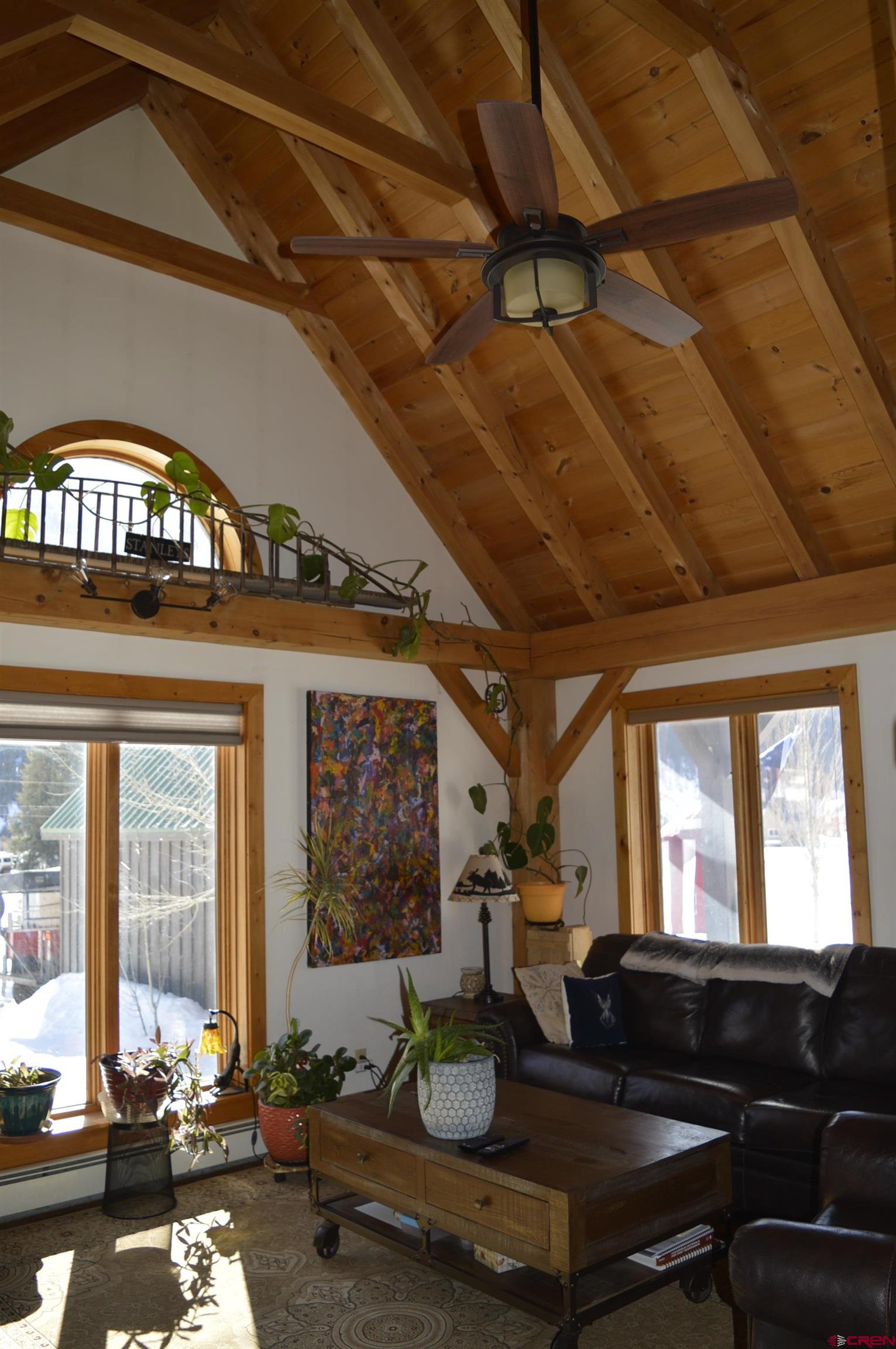 1505 Cement Street Silverton, CO 81433 - Photo 11 of 21 a living room with furniture fireplace and a large window